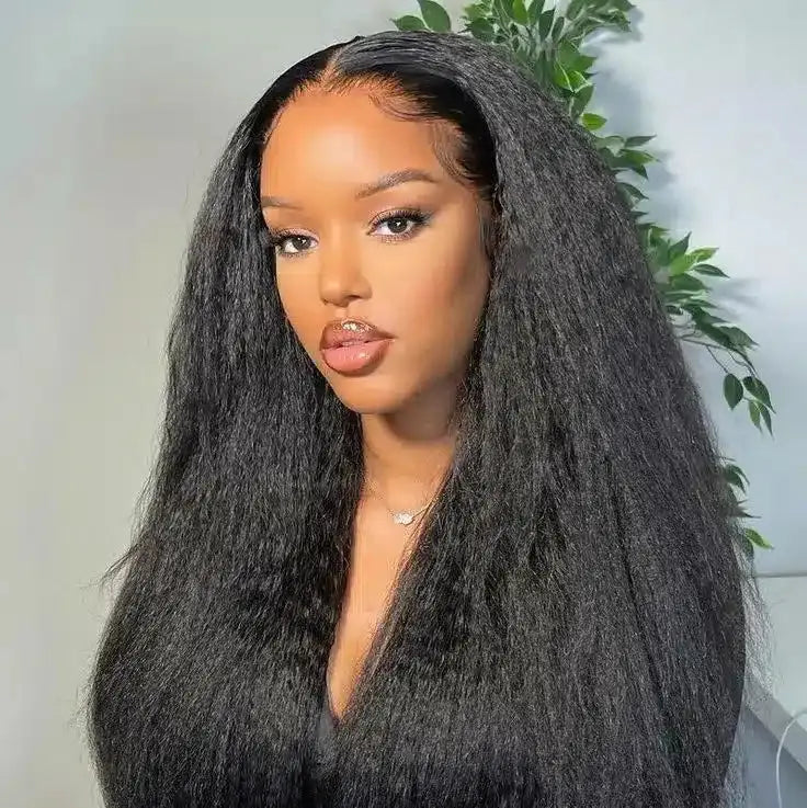 Woman with long, styled hair against a neutral background