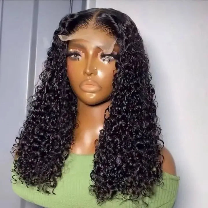 Mannequin head with long, curly black wig on a plain background