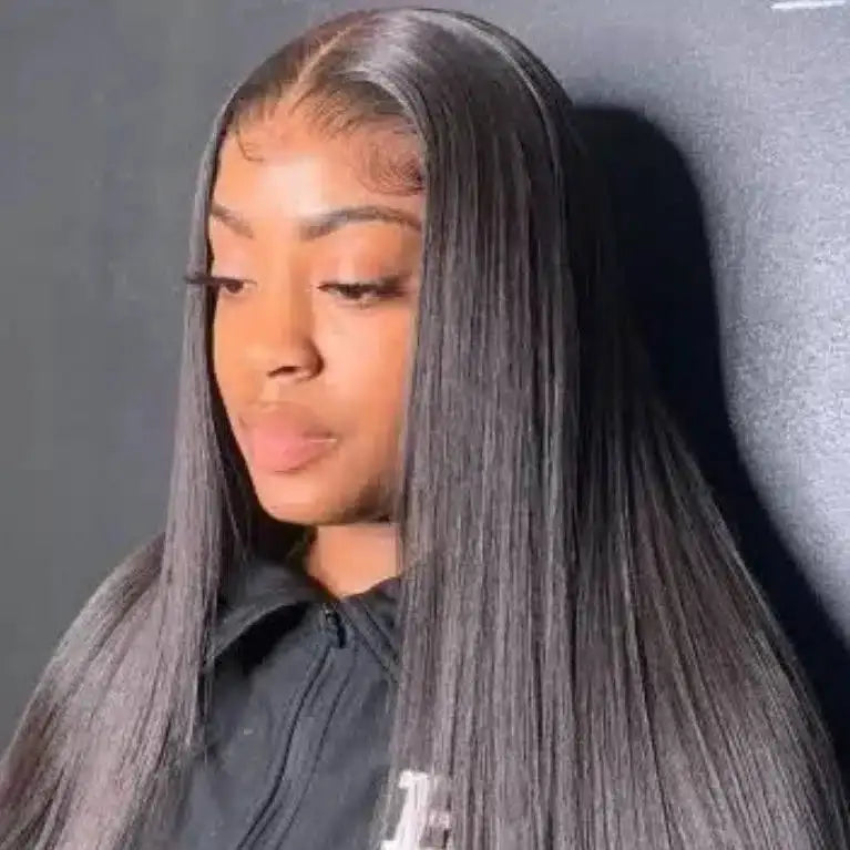 Person wearing a gray wig against a dark background