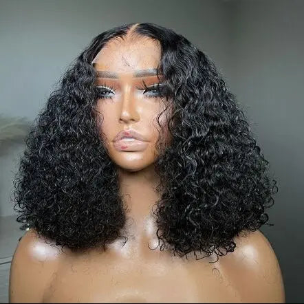 Black curly wig on a mannequin head against a neutral background