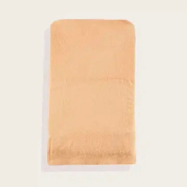 Beige towel on a white background