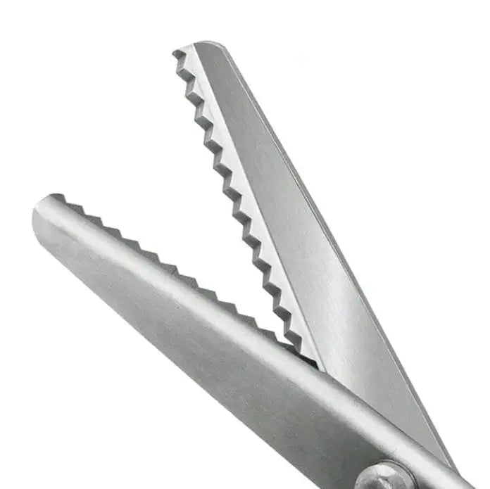 Close-up of a pair of metal tongs with a white background